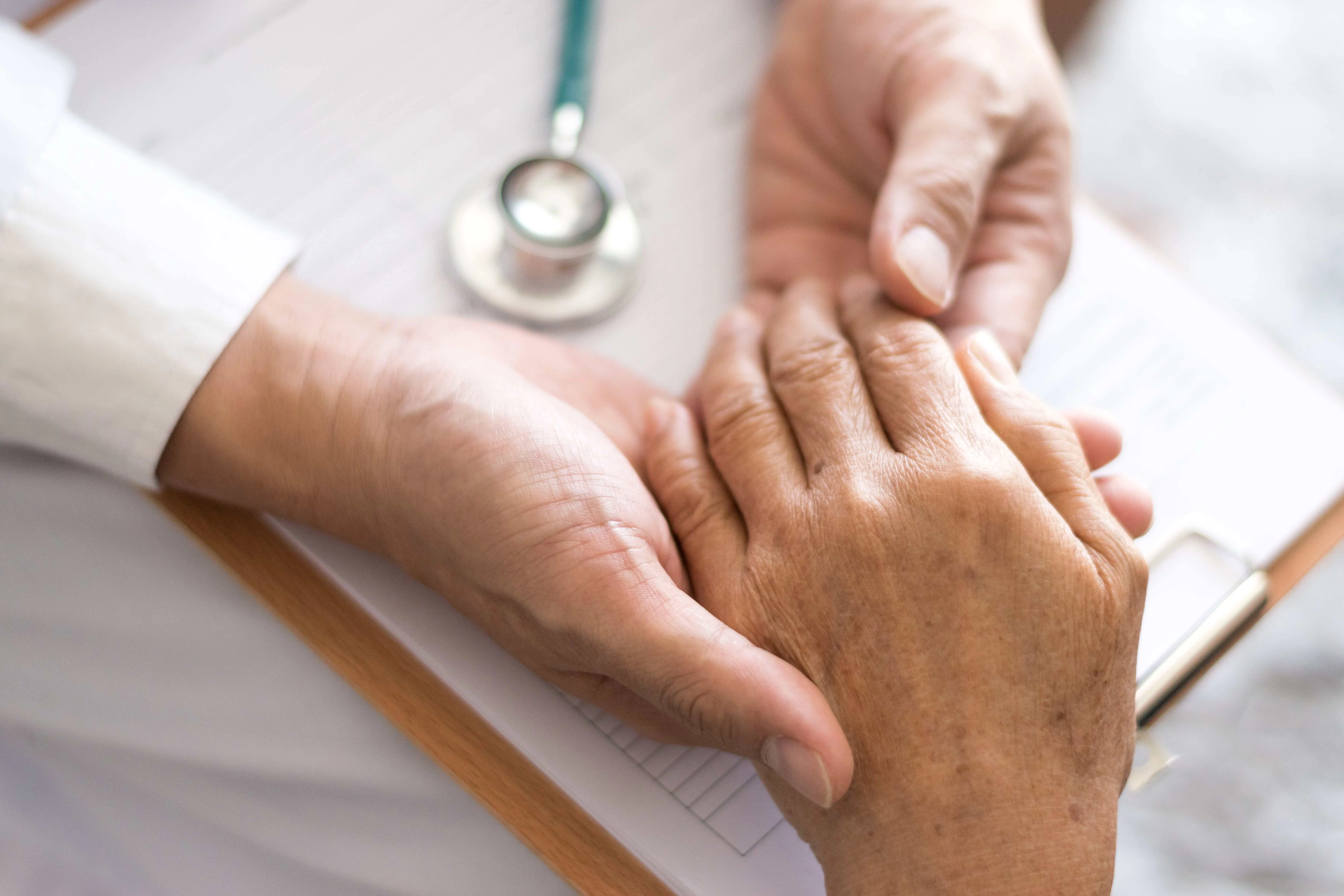 Elderly woman receiving compassionate support from a caregiver at Life Hospice.